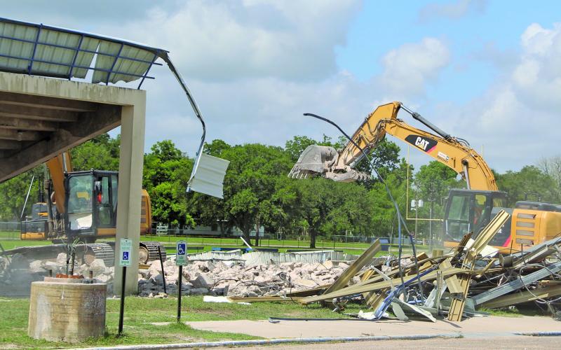 Sentinel photo/Mike Reddell The old Memorial Stadium stands and press box were the last go for the 1949 structure built when the high school at that site also was constructed. While the stands were deemed structurally unsafe, the track, field, and home-side field house will remain in place for junior high use.