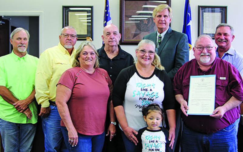 Sentinel photo/Mike Reddell Matagorda County Commissioners Court proclaimed June 2022 as Myuasthenia Gravis  Month at the court’s meeting Monday. Spokesman Simon DeSoto (second from right) said the disease is horrible, where the brain doesn’t communicate with the muscles and afflicts those from the young to the old.