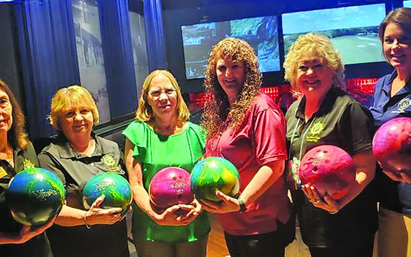 Sentinel photo/Jessica Shepard Members of the Pilot Club of Bay City recently donated lightweight bowling balls to Schulman’s Movie, Bowl &amp; Grille. The multi-colored balls have been drilled with holes for small fingers to help younger children being able to enjoy this sport at Schulman’s. Pilot Club members from left to right are Jennifer Bishop, Theresa Knebel, Loretta Griffin, Schulman's MBG Event Director Crystal Folse, Sue Jahnsen, and Kristi Lee.