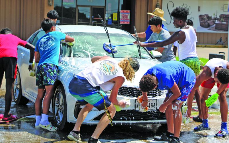 Sentinel photo/Mike Reddell Bay City 7on7 team members put a group touch at a car wash last week to raise money for the boys’ trip to College Station for the state 7on7 tournament June 23-25. Bay City and Tidehaven players both qualified for the state tournament.