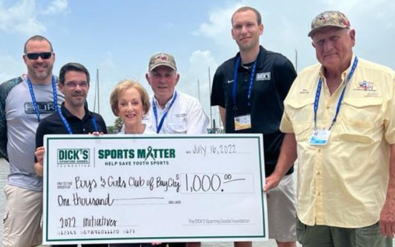 Contributed photo Janet Peden with the Boys &amp; Girls Club of Bay City and Matagorda County accepts a $1,000 check from Dick's Sporting Goods. She is flanked by Aaron Pisk, Community Marketing Manager (Houston South) for Dick’s Sporting Goods Foundation “Sports Matter” program, Ron Hartman and Curtis Denison, both directors with Texas Oilman’s Charity Fishing Tournament.