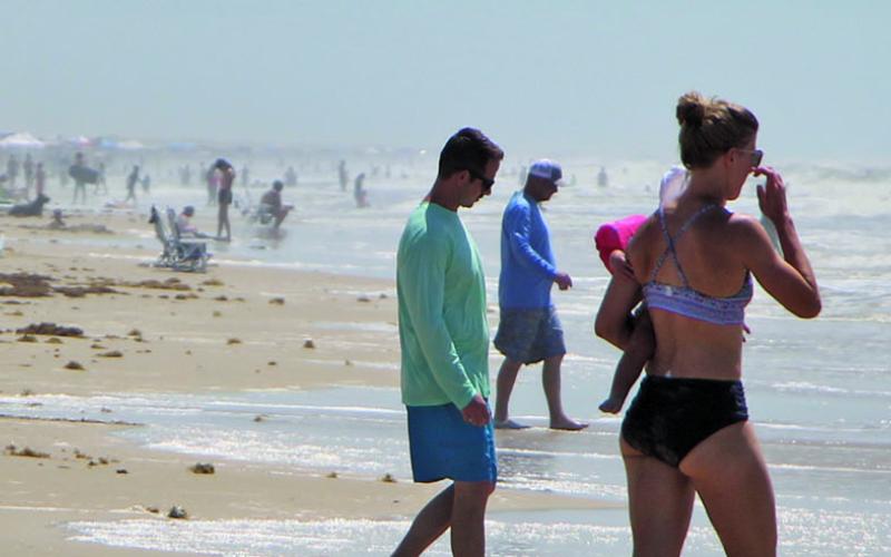 Crowds gather for the Fourth of July weekend at Matagorda Beach. Sentinel photo/ Mike Reddell