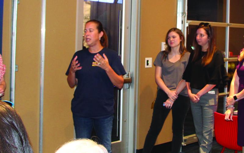Bay City Sentinel/Mike Reddell Rotary Club President Jessica Russell tells a chamber mixer last week that the club has booked Country Music Artist Chris Cagle for the Aug. 20 Rotary Summer Concert.