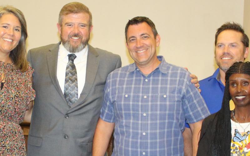 Sentinel photo/Jessica Shepard Newly hired Bay City ISD Superintendent Dr. Dwight McHazlett, Jr. (center left) joins trustees for a photo following their regular meeting Monday, Aug. 1.