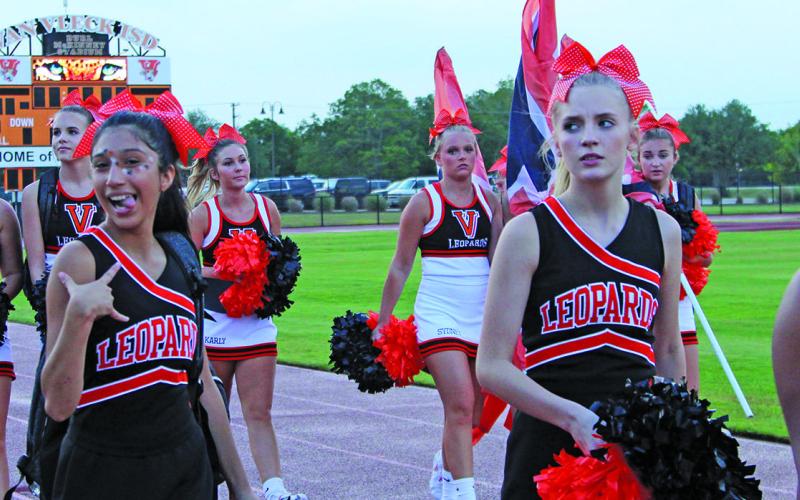 Van Vleck cheerleaders march in for the pep rally Aug. 11. Photo by  Anna Hernandez