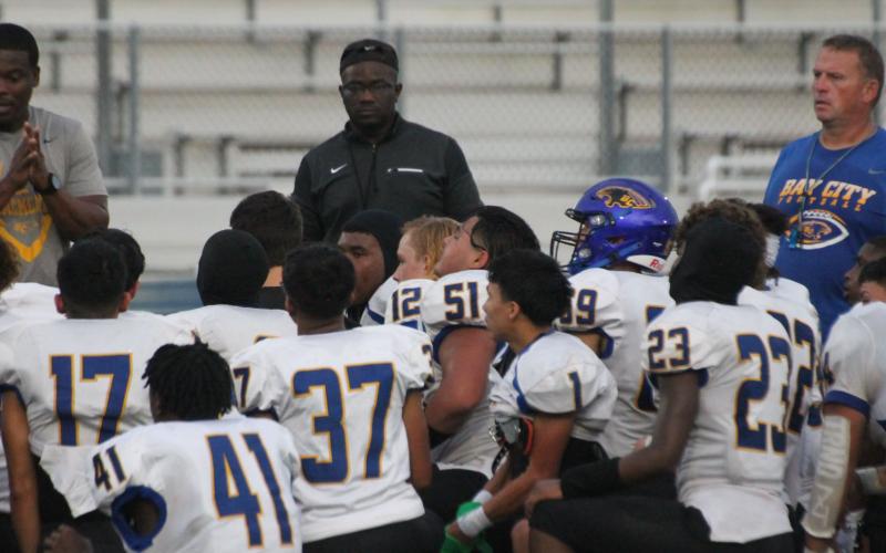 BCISD photo Blackcat coaches talk to players during Victoria East scrimmage.
