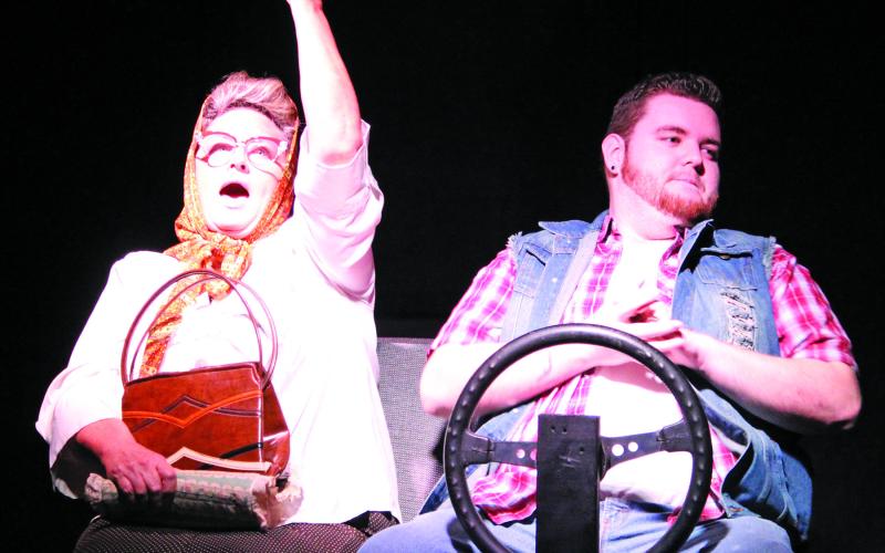Sentinel Photo/Jessica Shepard Marguerite celebrates a victory over her son Royce during a car ride argument over what to play on the radio. This scene is one of many hilarious moments in Community Actors of South Texas' production of "Dearly Departed" which has its final run this week. Marguerite and Royce are played by Lisa Carrillo and Jordan Poeppel respectively. See more on Page 5.
