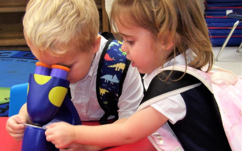 Courtesy photo Holy Cross Catholic School had its open house on Aug. 25. PreK-3 students with their microscopes provided a look at inquisitive young ones.