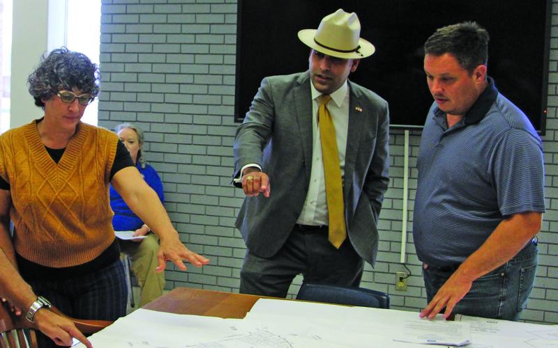 Sentinel Photo/Mike Reddell Bold Fox Development Managing Shareholder Alex Kamkar, center, explains subdivision plat to Planning Commissioners Zeinab Ghais, left, and Josh Fortenberry.