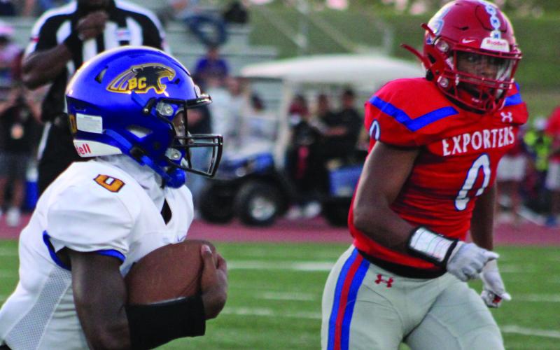 Sentinel Photo/Mike Reddell Blackcat sophomore running back Jada Andrews (0) looks to get around Brazosport defenders.