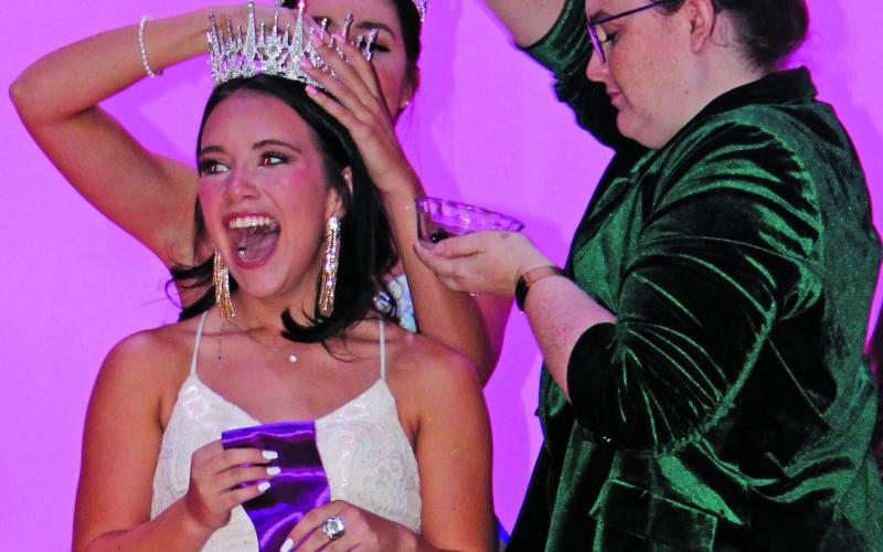 Sentinel Photo/MaLinda Reddell Rice Festival Queen Pageant coordinator Rachel Ricks, right, crowns Allyson Lucio as this year's winner. 