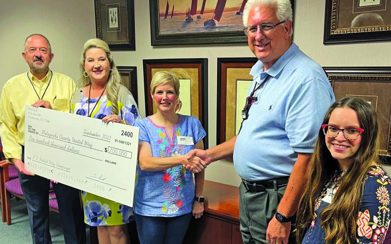 STP photo From left, STP’s CAO Al Capristo and Heather Caddie-Mendiola present Matagorda County United Way Executive Director Elizabeth Quillian with a donation check alongside STP CEO Tim Powell and United Way’s Rachel Johnson.