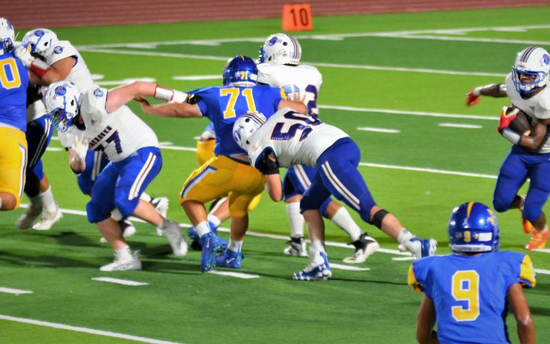 Photo/Dee Sneath Tiger running Joseph Dodds (5) gets an early opening for his run against Odem.