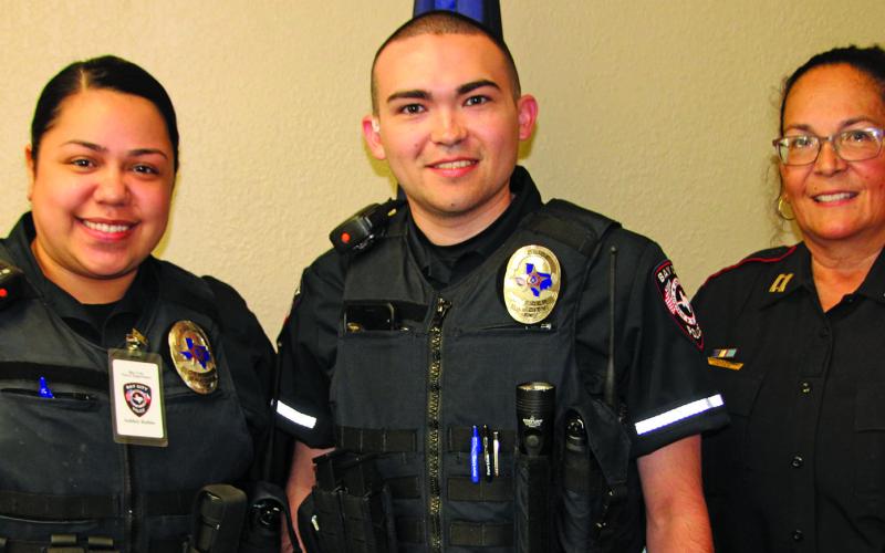 Sentinel Photo/Mike Reddell Bay City Police Department swore in two new officers in an Oct. 19 ceremony. Shown, from left, new officers Ashley Rubio and Tyler Jackson, with Interim Police Chief Christella Rodriguez.