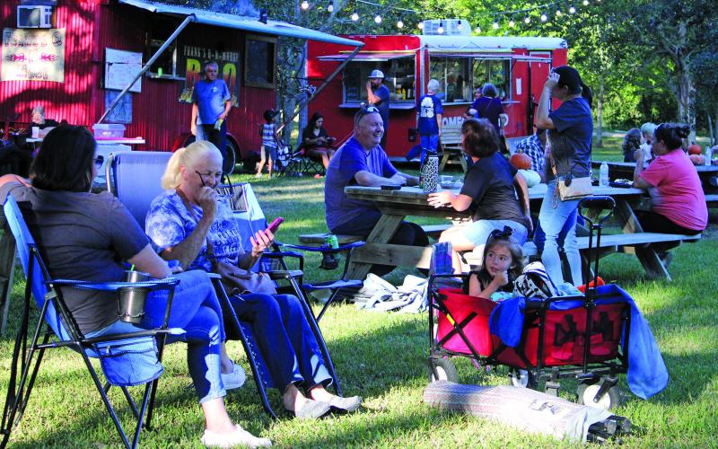 Sentinel photo/MaLinda Reddell People relax at the Full Moon Food Truck Festival Saturday evening, Oct. 15, at the Matagorda Birding Nature Center. The event had an impressive turnout and continues to grow, festival officials said.