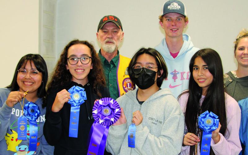 Sentinel Photo/Mike Reddell Winners of the annual Rice Dish Round-up contest were awarded blue ribbons on Tuesday, Oct. 18. Grand Champions, above, received purple ribbons along with a cash award and bag of rice. In no particular order are Lane Jacoby, grades 1-5; Jace Girndt, grades 6-8; Oscar Parga, grades 9-12; and Kathy Jackson, adult division. Not all are pictured.