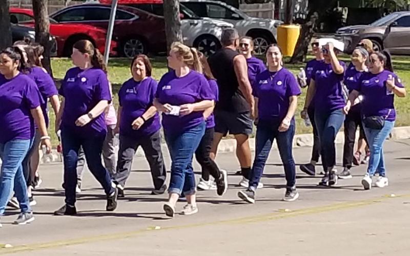 Sentinel Photo/Mike Reddell  Walk a Mile in Their Shoes was a mile-long walk from the Crisis Center to the courthouse Wednesday, Oct. 12. The Crisis Center-sponsored event was to bring awareness to domestic violence. At the courthouse there were guest speakers and a moment of silence.