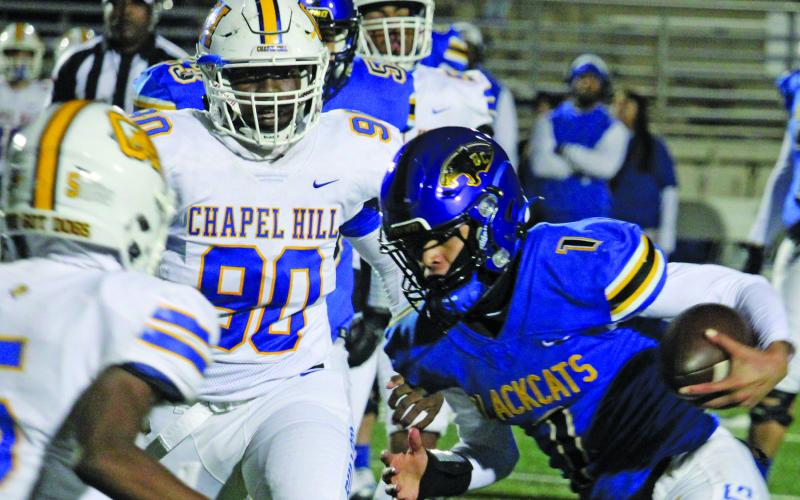 Sentinel Photo/Mike Reddell Blackcat quarterback Alex Estrada (1) picks up some tough yardage deep in Chapel Hill territory Friday night at Humble.
