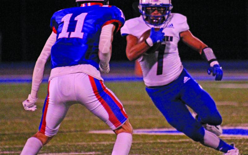 Anna Hernandez photo Tidehaven’s Chance McRae (7) works to get around a Nixon-Smiley defender in the Tigers winning area playoff game at Rice Consolidated last Friday, Nov. 18.