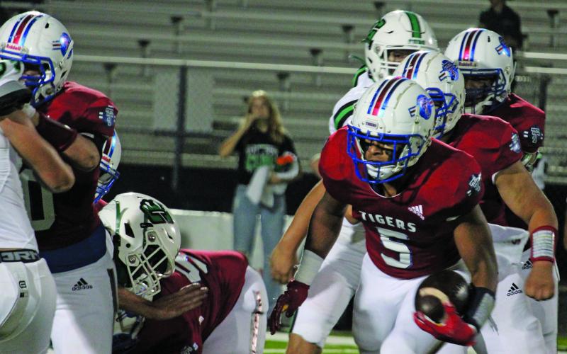 Sentinel Photo/Mike Reddell Tidehaven running back Joseph Dodds (5) follows his blockers in picking up yards.