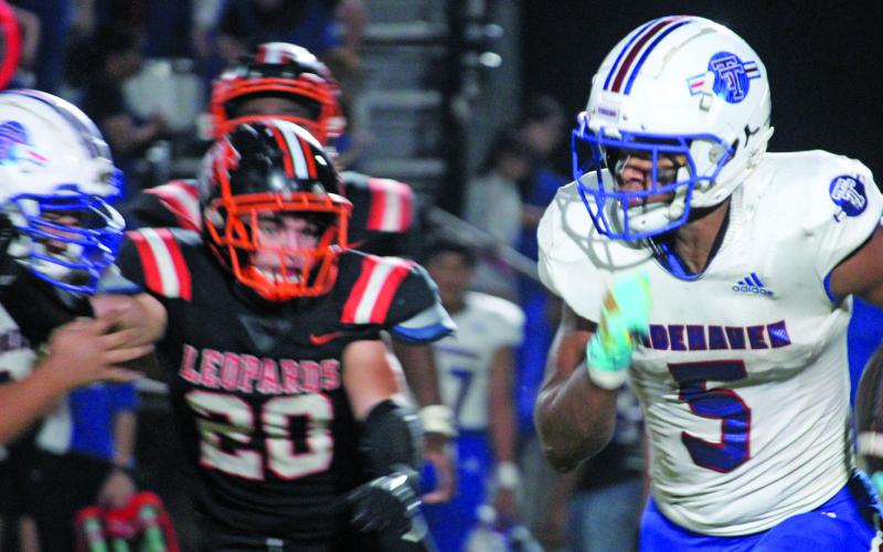 Sentinel Photo/Mike Reddell Tidehaven’s Joseph Dodds (5) picks up yards around end against the Leps.