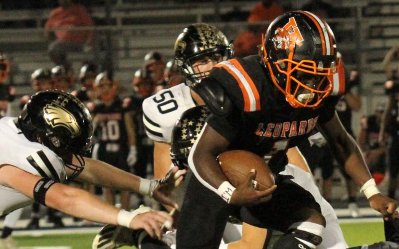 Photo/Anna Hernandez Van Vleck’s Cam Austin (1) does everything to get though Rogers defense line and stays on his feet to gain a few yards.