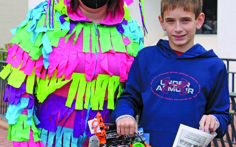 Shown with Ashlee Shepard (pinata), is Colin Holub, who was the 9-12 age group.