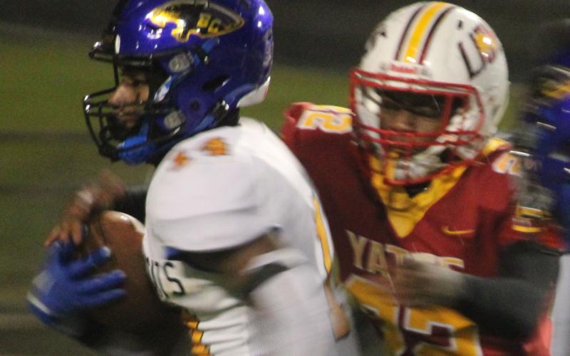 Sentinel photo/Mike Reddell Bay City running back Paris Fox (14) picks up yardage against Yates in the bi-district playoff in Houston, Friday, Nov. 11.