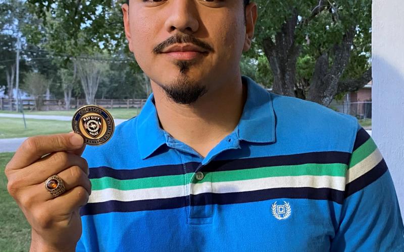 BCPD photo Corporal Jose Soto shows off Chief’s Challenge Coin.