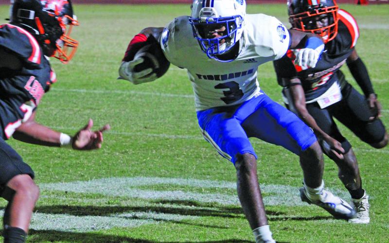 Sentinel Photo/Mike Reddell Tidehaven’s T’Shaun Davis looks for an opening against Van Vleck.