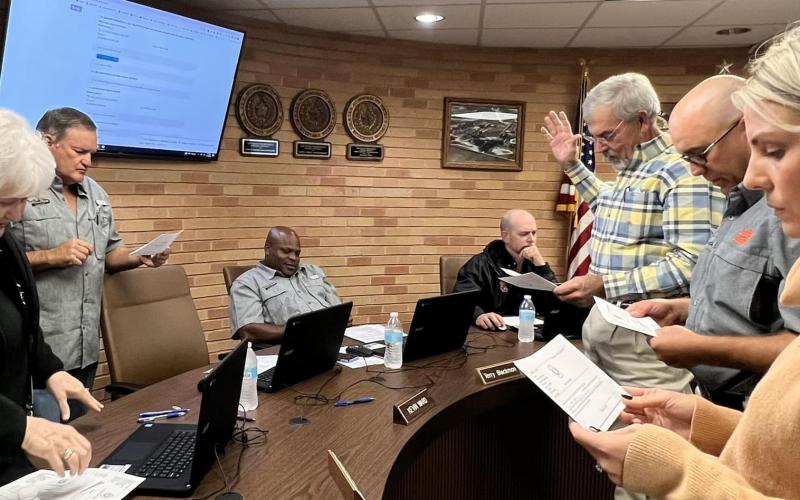 Contributed photo Van Vleck ISD Superintendent's Secretary Pat Hackworth, left, swears in school board members Tony Kucera, Laura Kubecka, Marcus Moss, and Donnie O'Connell during the board's regular meeting Monday, Nov. 14.