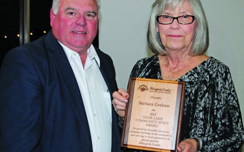 Photo by Mike Reddell Mitch Thames presents Tiger Lane Award to Barbara Graham