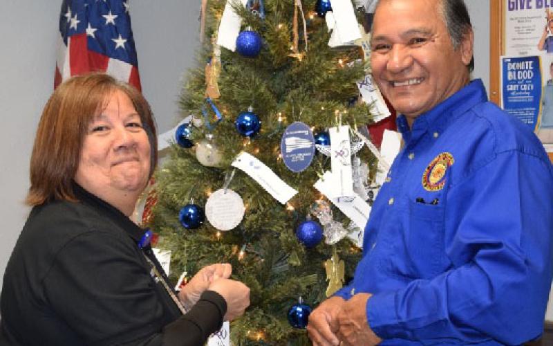 Crime Victim Liaison Lettie Ramos and Police Chaplain Joe Ramos are shown putting ornaments on Bay City Police Department’s Angel Tree. BCPD’s Victim Services held the Tree of Angels Ceremony honoring the victims of crime who are no longer with us on Thursday, Dec. 1. BCPD photo