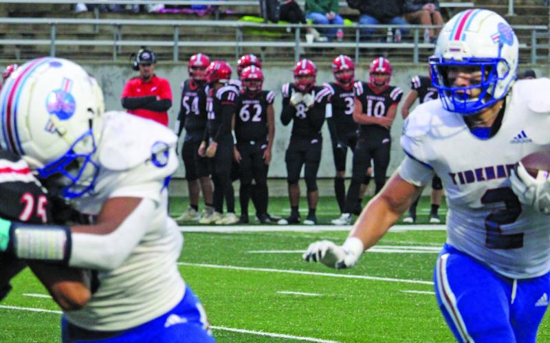 Sentinel Photo/Mike Reddell Tidehaven’s Jachen Duran (2) follows a block from running back Joseph Dodds (5) against Brazos defenders, as the Tigers take the regional playoff title at Rosharon’s Freedom Field last Friday.