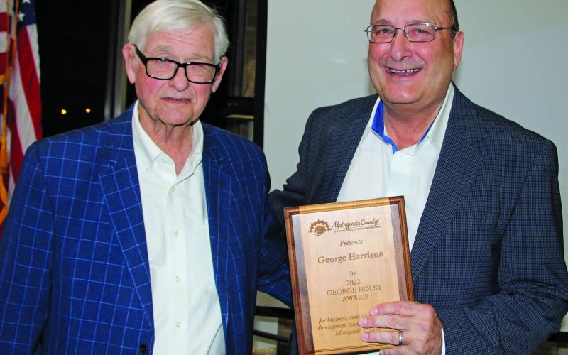 Photo by Mike Reddell Bill Cornman presents George Holst Award to George Harrison