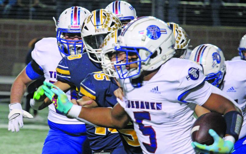 Sentinel Photo/Mike Reddell Tidehaven running back Joseph Dodds picks up yardage against Poth in the quarterfinal game at Texas State stadium Friday, Dec. 2.