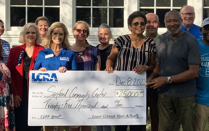 LCRA Photo LCRA representatives present a $25,000 grant to the Sanford Community Center for an exercise and birding trail.