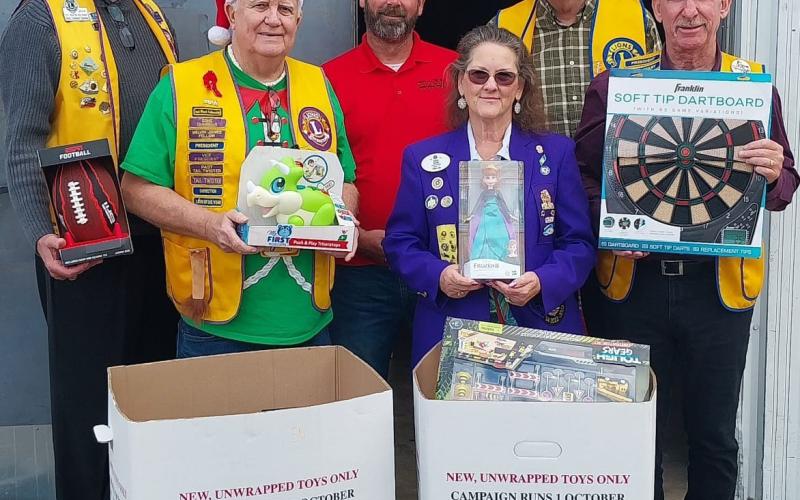Courtesy photo Bay City Lions Club members donated toys for this year's "Toys For Tots" on Dec. 16. Pictured left to right are County Judge Nate McDonald, Doc Cambell, Toys For Tots coordinator James Scardami, Lions District Governor Vicki Dulin, Ben Carter, and Mike Finster.