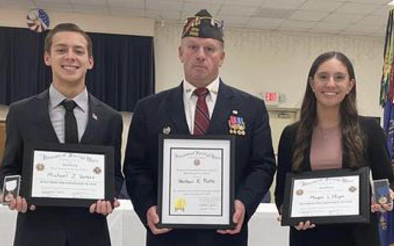 Contributed photo Philip H. Parker VFW Post No. 2438 recently presented awards to a Bay City High School teacher and two BCHS students. From left, Michael Vargas, won third place for the Voice of Democracy Essay, Nathan Potts, was named VFW Teacher of the Year, and Megan Moya came in second place for the Voice of Democracy Essay.
