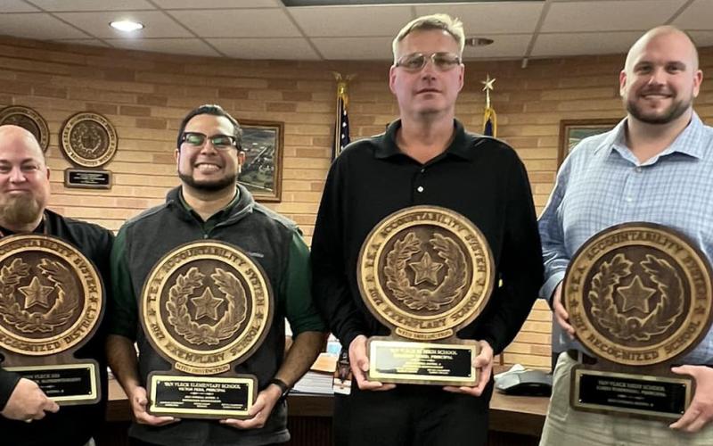 VVISD photo Van Vleck ISD Superintendent John O'Brien, left, presented plaques to campus leadership for recognition of their respective Texas Education Agency (TEA) accountability ratings at a recent school board meeting. From left are: Van Vleck Elementary Principal Victor Pena, Junior High Principal Brandon Hood, and High School Principal Matt Steiner.