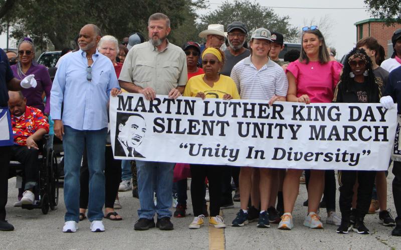 Sentinel Photo/Mike Reddell Participants in the Martin Luther King Day Silent Unity March prepare to step off from the old Linnie Roberts Elementary parking lot Monday, March 16. The event drew marchers estimated in the 40s.