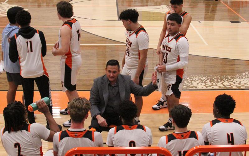 Photo by Anna Hernandez Leopard Head Basketball Coach Billy Ramey talks to his squad in last week’s 52-42 win over Brazos, Friday, Jan. 20. The Leopards are 11-8, 6-1 and second in District 24-3A-2.