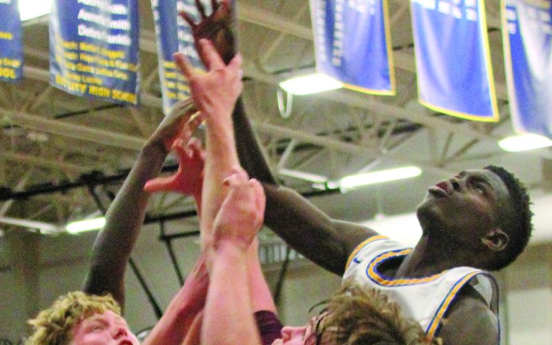 Photo by Anna Hernandez A Blackcat reaches higher than Columbia defenders in this recent game. Bay City won 55-47 over Columbia. Bay City stands 6-17, 2-6 on the season.