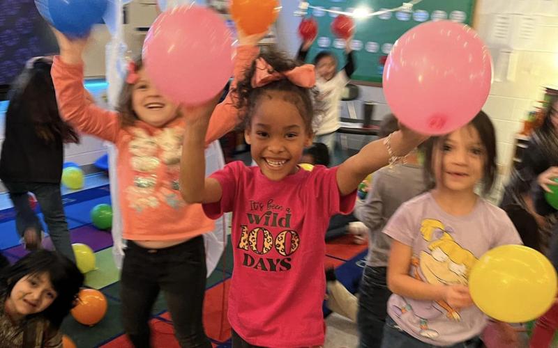 BCISD photo Cherry Elementary students celebrate the recent observance of the 100th day of school with a balloon drop.