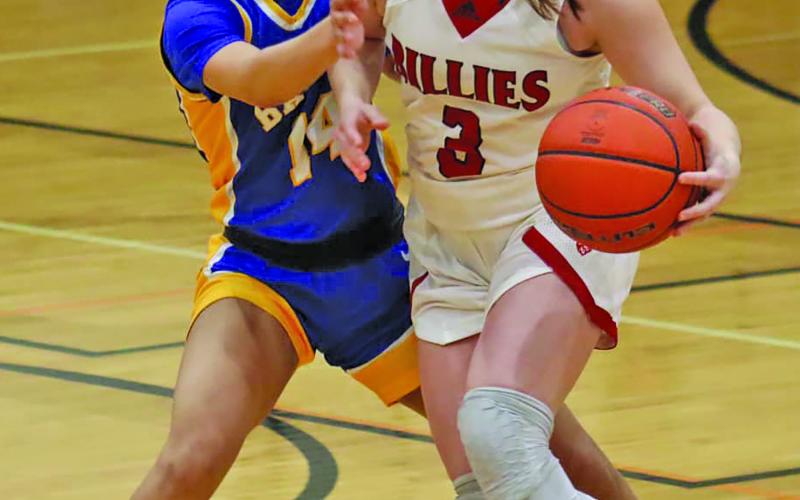 Courtesy photo Ladycat junior guard Madison Thrift (14) moves to slow down a Fredericksburg Billie player in the UIL state tournament area round last week. The girls lost 66-31, after winning the bi-district title. The Ladycats under Coach Chandi Jones finish the season with a 29-2 season mark and 12-0 and first in District 26-4A-1.