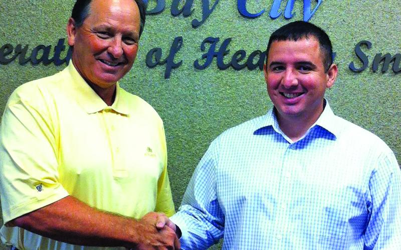 JSL photo Dr. Crayden Dennard and Dr. Rick Lucio of Dental Arts of Bay City