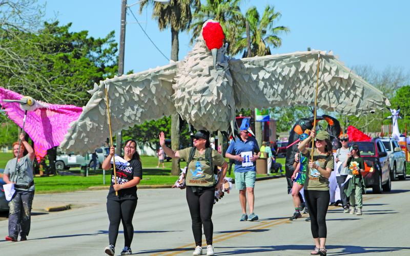 Sentinel Photo/Mike Reddell The 7th Annual Birdfest parade featuring several creative avian characters wound through downtown Palacios Saturday, March 25.