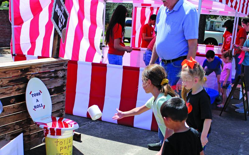 Sunshine and Rainbows PTO hosted an all-ages carnival Saturday, March 25. Children got to use tickets to play carnival and midway games like the "Toss A Roll" game above.  Sentinel Photo/ Jessica Shepard