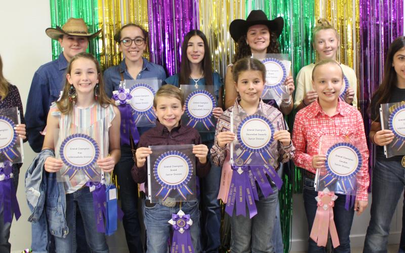 Sentinel Photo/Jessica Shepard Matagorda County Fair and Livestock Association's Home Economics food entry winners received purple rosettes for their win as Grand Champions of their chosen divisions Saturday, Feb. 25. Winners include Jase Alford, Analyn Sutherland, Ellie Curtner, Abigail Jurek, Clara Dodd, Karoline Murray, Jace Reynolds, Aribella Carson, Marley Kennedy, Jace Girndt, Victoria Sliva, Jasmine Anderson, Audrey Delgado, Shawn Sneath, Savannah Remmy, and Ava Bowers.
