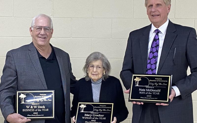Photo/Carol Ferdinand At the recent Palacios Chamber of Commerce annual banquet, the honorees included, from left: Business of the Year Craig Wallis, owner of W &amp; W Dock; Woman of the year Mary  Crocker; and Man of the Year Nate McDonald.